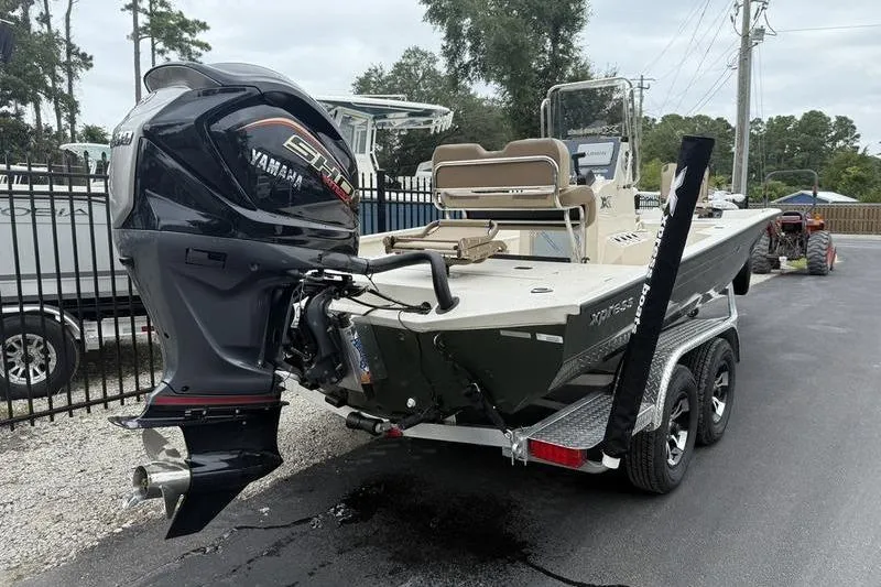 Slide: The Image of 2026 Xpress H22B boat with Yamaha engine on a trailer. - 4