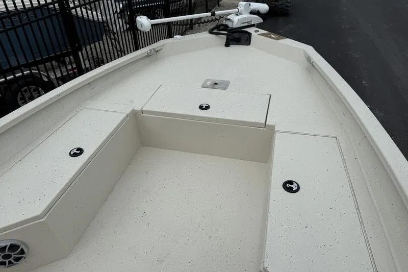 Slide: The Image of 2026 Xpress H22B boat deck with storage compartments and trolling motor. - 6