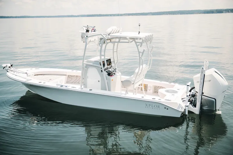 Slide: The Image of 2021 Xplor x24 Andros boat on calm water, featuring sleek design and modern equipment. - 11