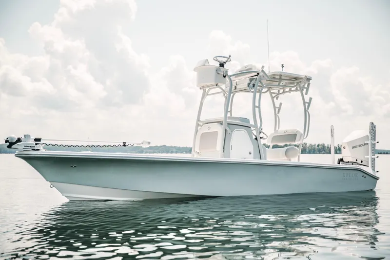 Slide: The Image of 2021 Xplor x24 Andros boat on calm water under cloudy sky. - 7