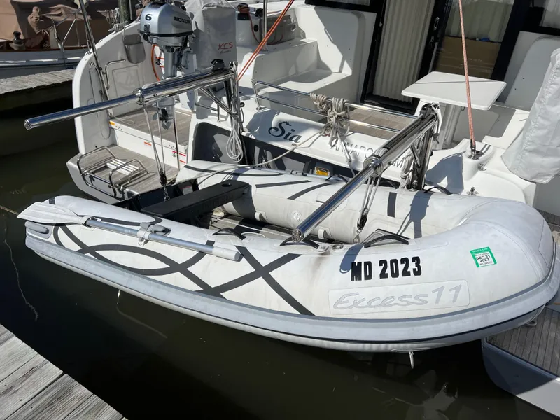 Slide: The Image of Inflatable boat Excess XCS 11, 2022 model, docked with outboard motor. - 10