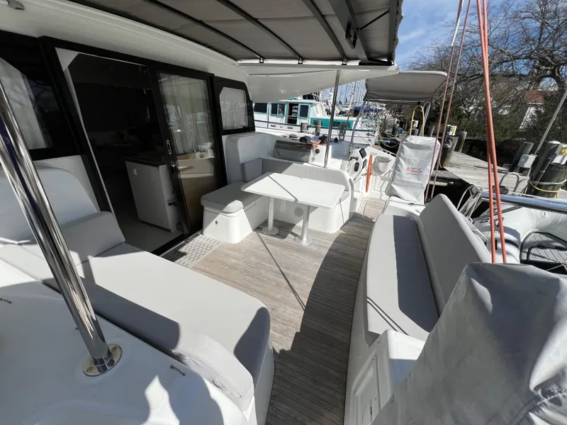 Slide: The Image of Spacious deck of 2022 Excess XCS 11 yacht with seating and table. - 2