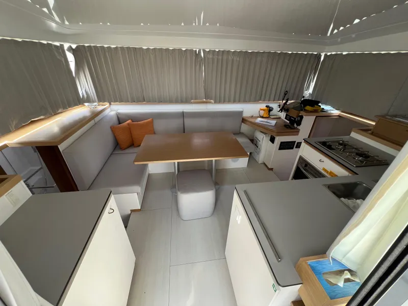 Slide: The Image of Modern interior of 2022 Excess XCS 11 catamaran with kitchen and dining area. - 3