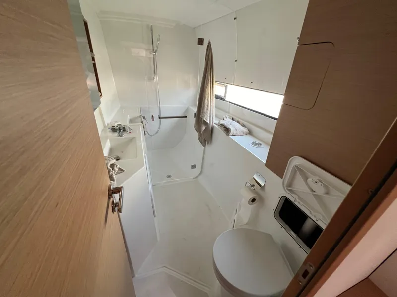 Slide: The Image of Modern bathroom in 2022 Excess XCS 11 yacht, featuring shower, sink, and toilet. - 5