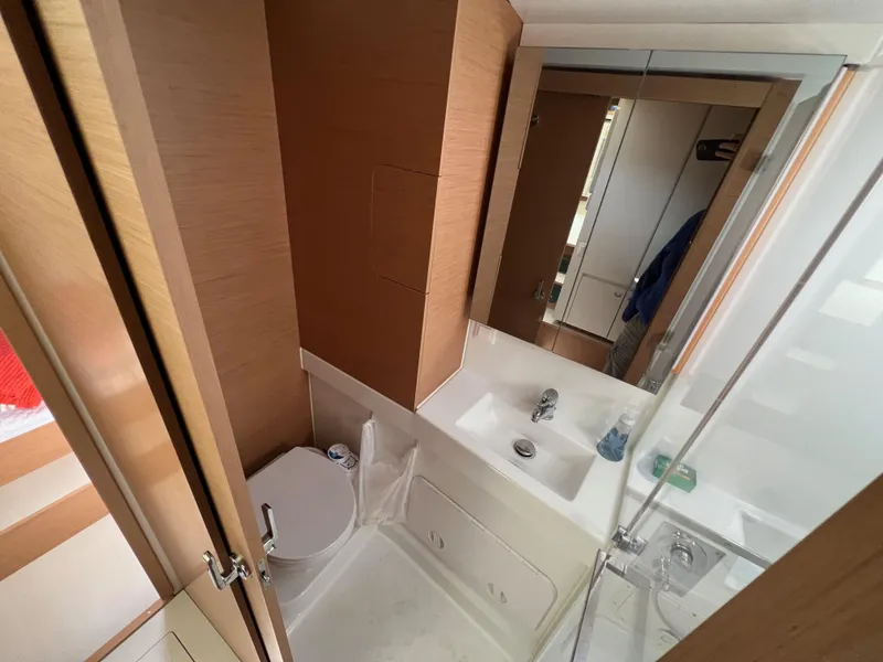 Slide: The Image of Modern bathroom in 2022 Excess XCS 11 yacht with sleek design and wooden accents. - 8
