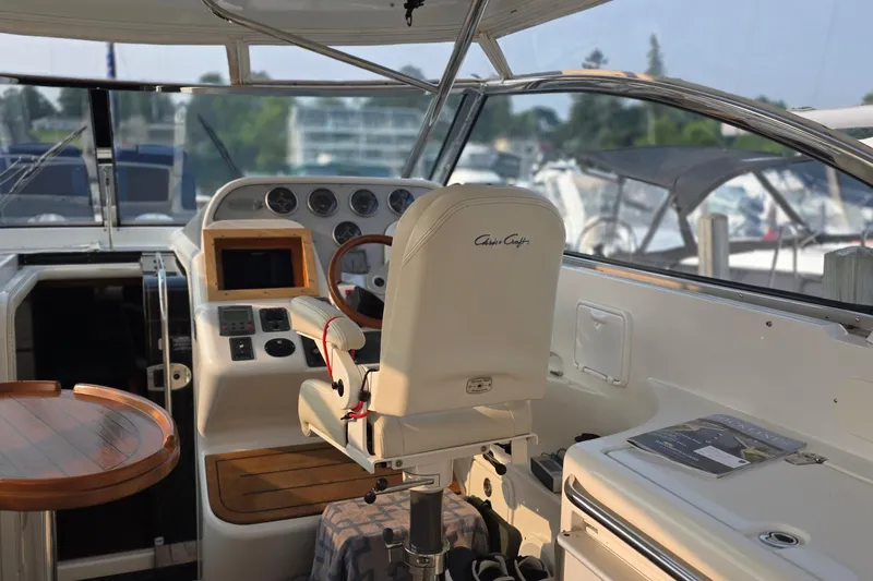 Slide: The Image of Helm of 2005 Chris-Craft Roamer 40 yacht with steering wheel and control panel. - 20