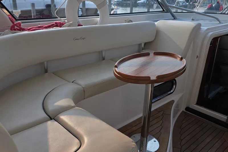 Slide: The Image of Luxurious 2005 Chris-Craft Roamer 40 yacht interior with elegant seating and wooden table. - 28