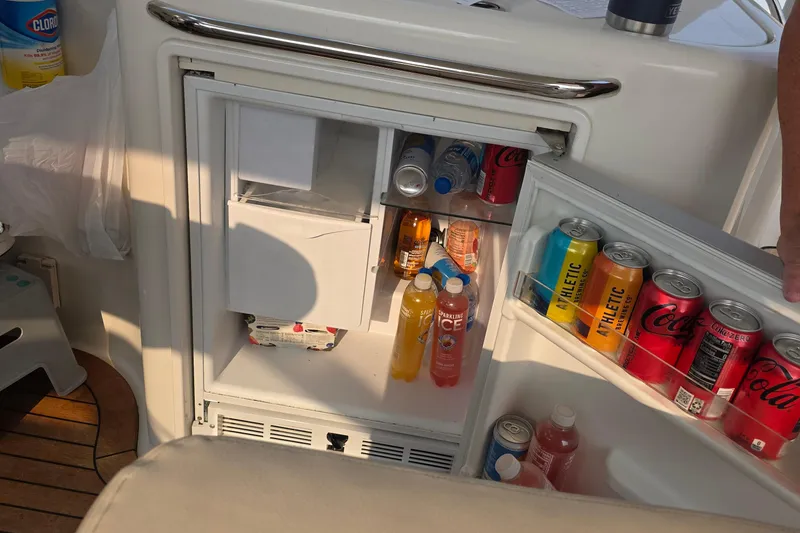 Slide: The Image of Mini fridge stocked with beverages on a 2005 Chris-Craft Roamer 40 yacht. - 29