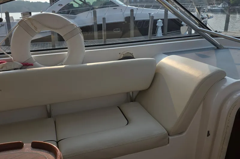Slide: The Image of Interior of 2005 Chris-Craft Roamer 40 yacht with white seating and life preserver. - 31