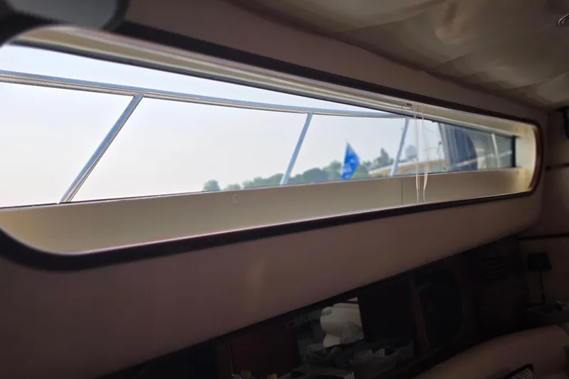 Slide: The Image of Interior view from a 2005 Chris-Craft Roamer 40 yacht window, showcasing sleek design. - 45