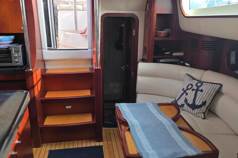 Slide: The Image of Luxurious interior of 2005 Chris-Craft Roamer 40 yacht with elegant seating and nautical decor. - 47