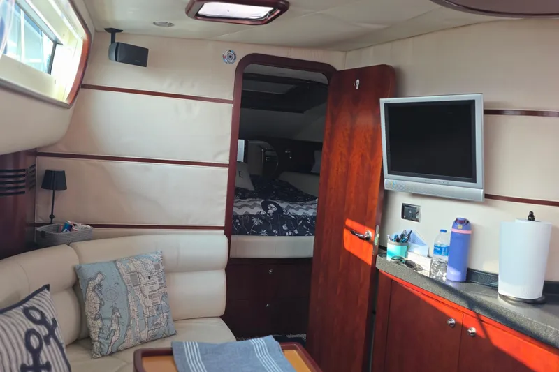 Slide: The Image of Luxurious interior of 2005 Chris-Craft Roamer 40 yacht with cozy seating and modern amenities. - 49