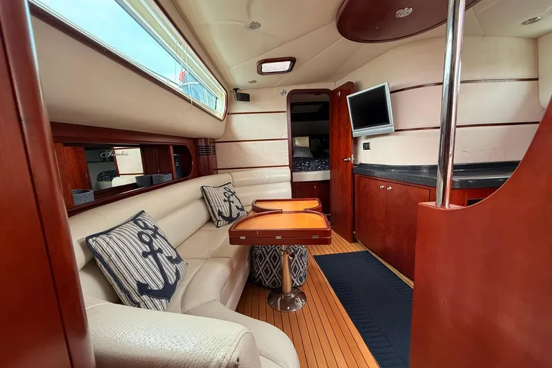 Slide: The Image of Luxurious interior of 2005 Chris-Craft Roamer 40 yacht with elegant wood finishes and nautical decor. - 50