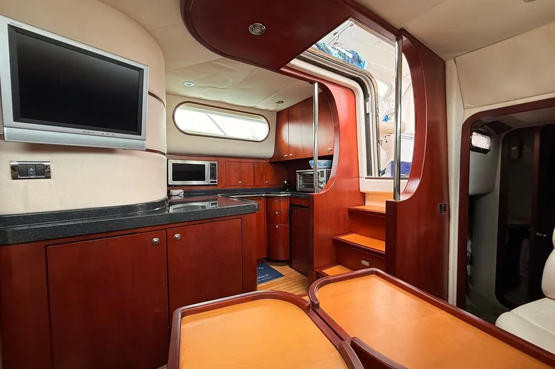 Slide: The Image of Luxurious 2005 Chris-Craft Roamer 40 yacht interior with modern kitchen and entertainment area. - 51