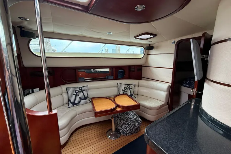 Slide: The Image of Luxurious 2005 Chris-Craft Roamer 40 yacht interior with elegant seating and nautical decor. - 55