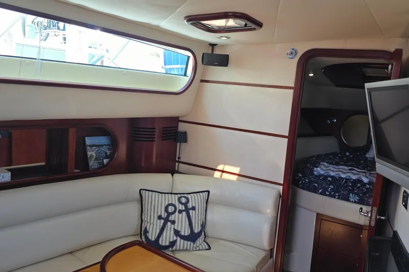 Slide: The Image of Luxurious interior of 2005 Chris-Craft Roamer 40 yacht with cozy seating and elegant decor. - 64