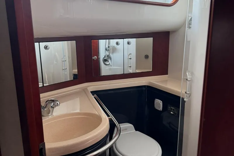 Slide: The Image of Luxurious bathroom in 2005 Chris-Craft Roamer 40 yacht with modern fixtures and elegant design. - 65