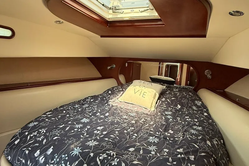 Slide: The Image of Luxurious cabin interior of 2005 Chris-Craft Roamer 40 yacht with skylight and floral bedding. - 66