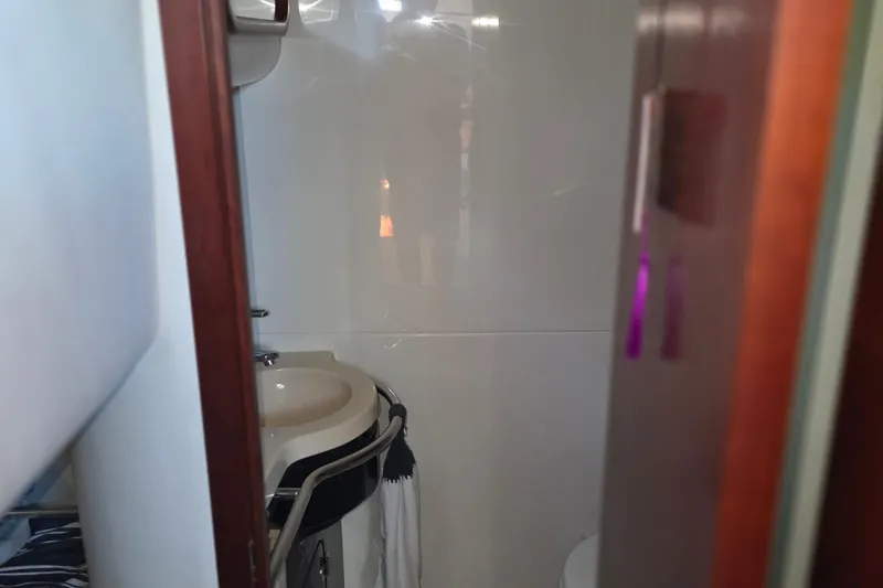 Slide: The Image of Bathroom interior of 2005 Chris-Craft Roamer 40 yacht, featuring sink and towel rail. - 72