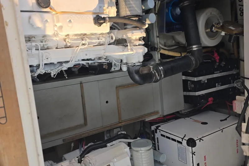 Slide: The Image of Engine room of 2005 Chris-Craft Roamer 40 yacht, showcasing mechanical components and systems. - 78