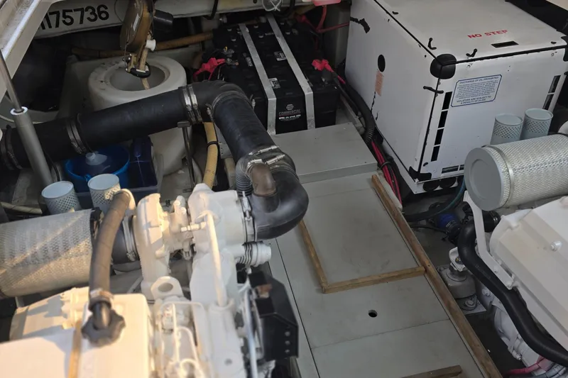 Slide: The Image of Engine room of 2005 Chris-Craft Roamer 40, showcasing mechanical components and systems. - 79