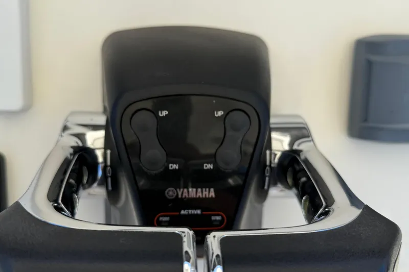 Slide: The Image of Close-up of Yamaha throttle controls on a 2015 Cobia 296 Center Console boat. - 5