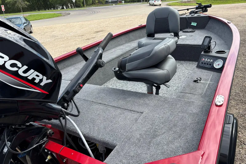 Slide: The Image of 2025 Tracker Super Guide V-16 T boat interior with Mercury engine, gray seating, and control panel. - 30