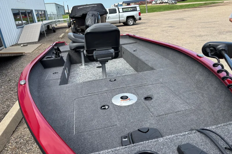 Slide: The Image of 2025 Tracker Super Guide V-16 T boat interior with seating and storage compartments. - 31