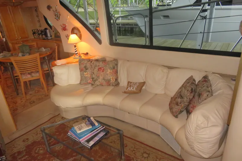 Slide: The Image of Luxurious interior of 2000 Bluewater Yachts 5800 with cozy seating and elegant decor. - 11