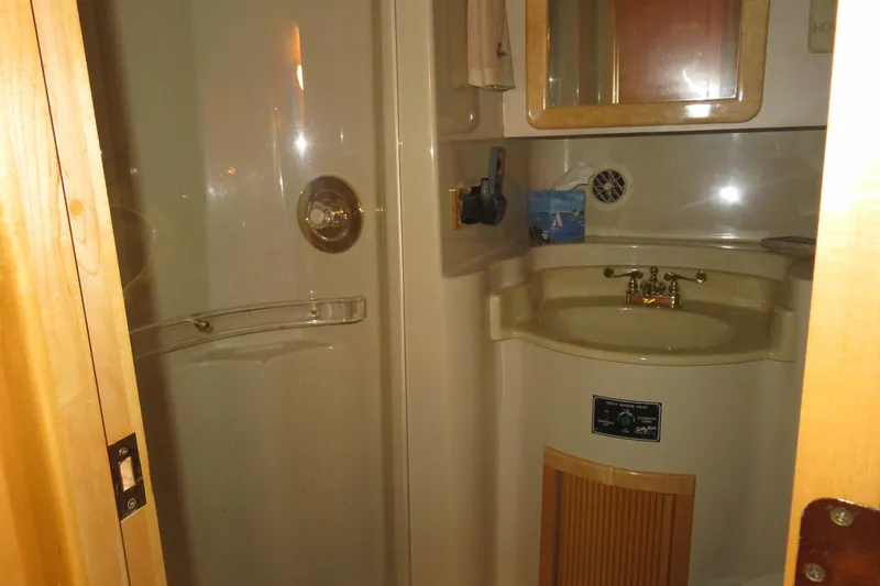 Slide: The Image of Bathroom interior of 2000 Bluewater Yachts 5800, featuring sink and shower. - 14