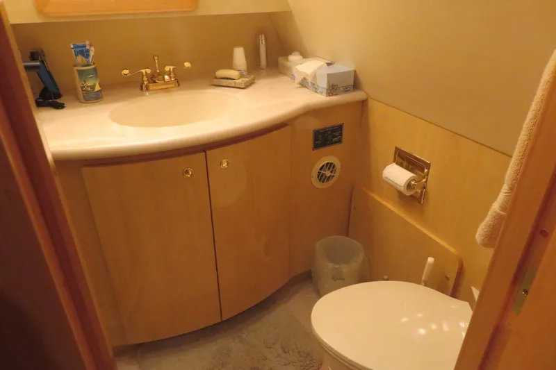 Slide: The Image of Bathroom interior of 2000 Bluewater Yachts 5800, featuring sink and toilet. - 22