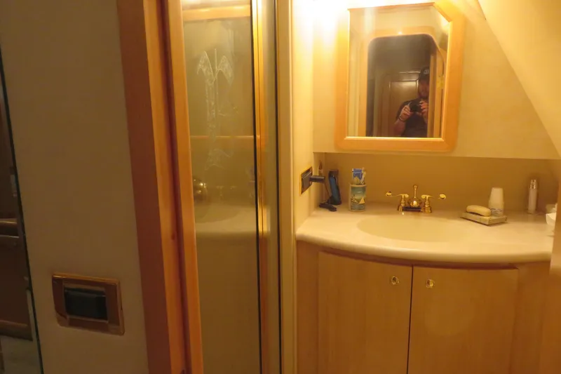 Slide: The Image of Bathroom interior of 2000 Bluewater Yachts 5800 with sink and mirror. - 23