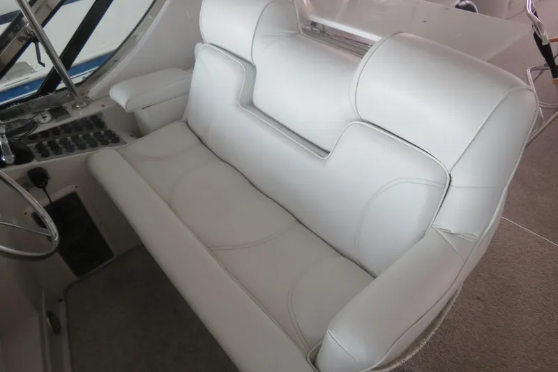 Slide: The Image of White leather seating in 2000 Bluewater Yachts 5800 cockpit, showcasing luxury and comfort. - 4