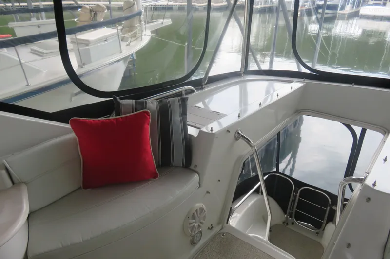 Slide: The Image of Interior view of 2000 Bluewater Yachts 5800 with red and striped cushions. - 9