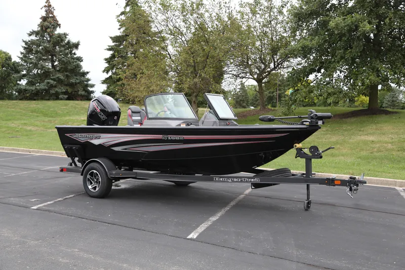 The Image of 2024 Ranger VS1682SC Angler boat on trailer in parking lot. - 0