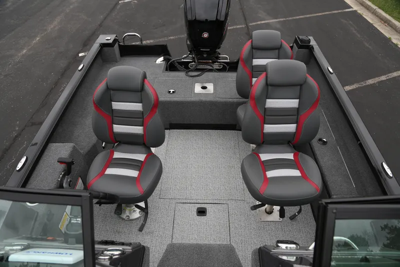 Slide: The Image of 2024 Ranger VS1682SC Angler boat interior with four cushioned seats and motor. - 3