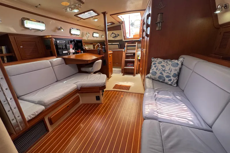 Slide: The Image of Luxurious 2004 Island Packet 420 yacht interior with plush seating and elegant wood finishes. - 17