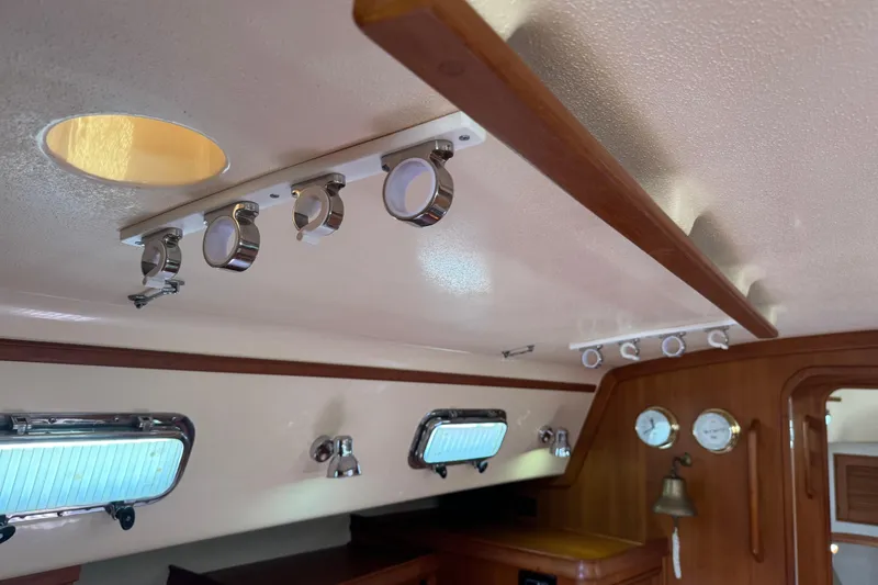 Slide: The Image of Interior of 2004 Island Packet 420 yacht with wooden accents and porthole windows. - 30