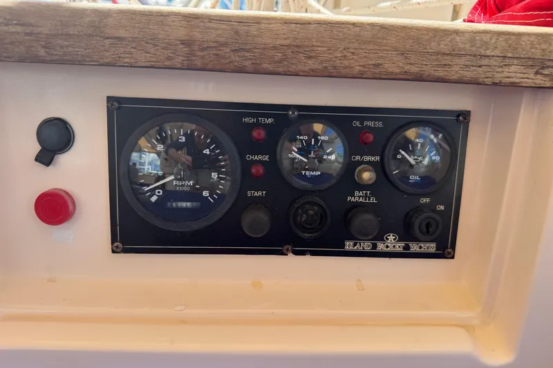 Slide: The Image of Control panel of a 2004 Island Packet 420 yacht with gauges and switches. - 39