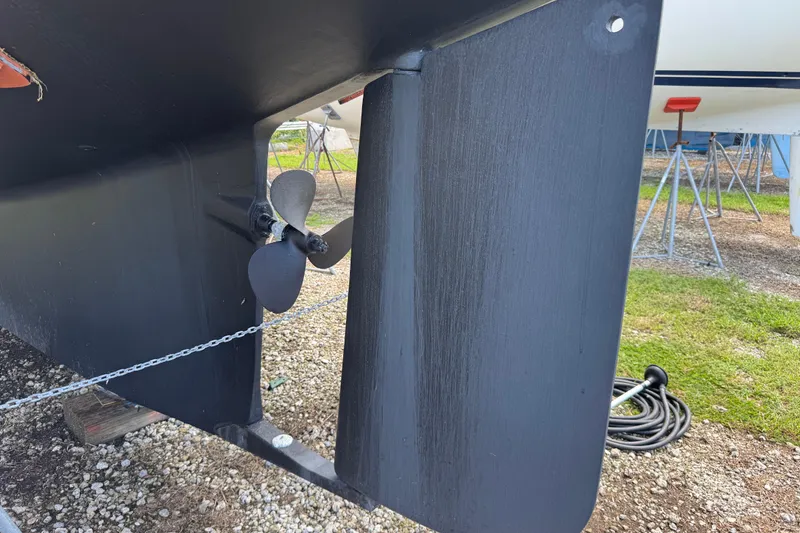 Slide: The Image of Close-up of 2004 Island Packet 420 sailboat propeller and rudder on dry dock. - 47