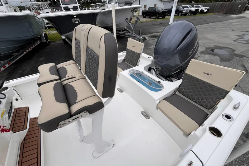 Slide: The Image of 2022 Tidewater 2110 Bay Max boat interior with Yamaha engine and cushioned seating. - 13