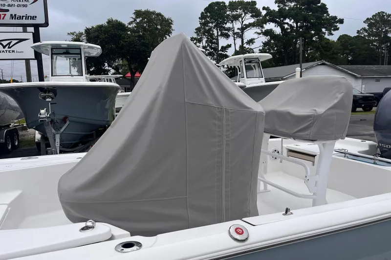 Slide: The Image of 2022 Tidewater 2110 Bay Max boat with covered console and seats. - 15