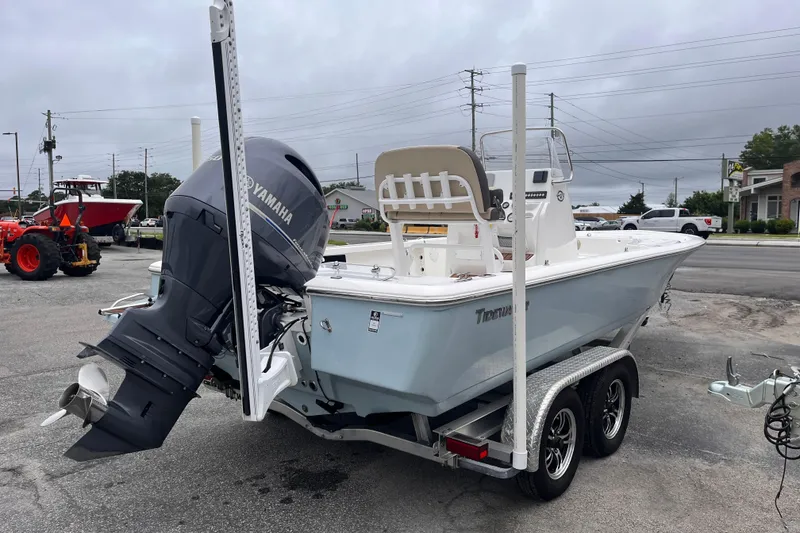 Slide: The Image of 2022 Tidewater 2110 Bay Max boat on trailer with Yamaha outboard motor. - 4