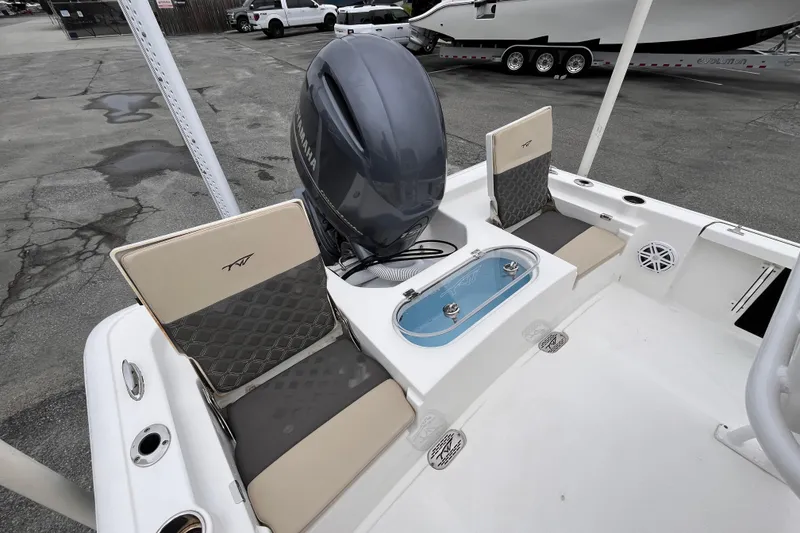Slide: The Image of 2022 Tidewater 2110 Bay Max boat interior with Yamaha engine and seating. - 6