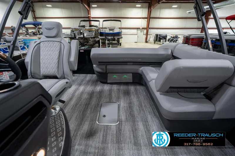 Slide: The Image of 2026 Bennington 26 MSB boat interior with luxurious seating and modern dashboard. - 16