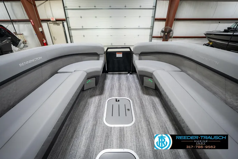 Slide: The Image of 2026 Bennington 26 MSB pontoon boat interior with plush seating and modern design. - 20