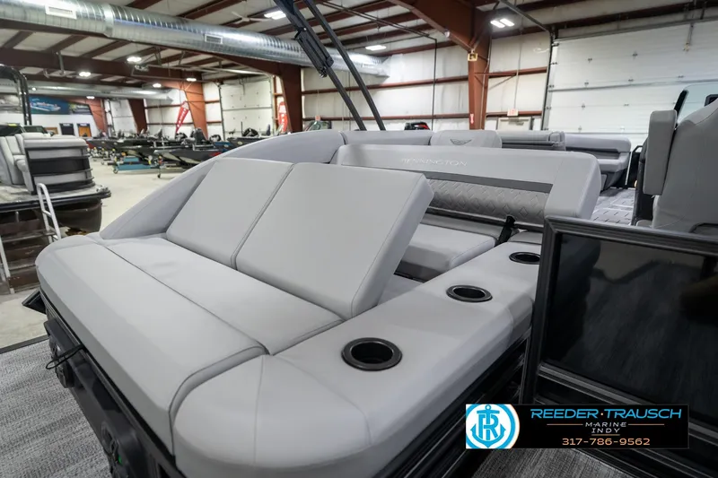 Slide: The Image of 2026 Bennington 26 MSB boat interior with luxurious gray seating and ambient lighting. - 25