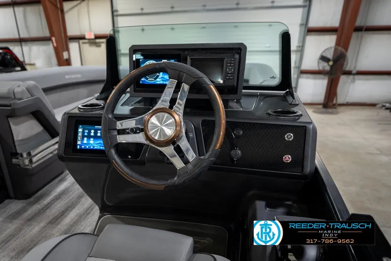 Slide: The Image of 2026 Bennington 26 MSB boat interior with open storage compartment and modern design. - 31