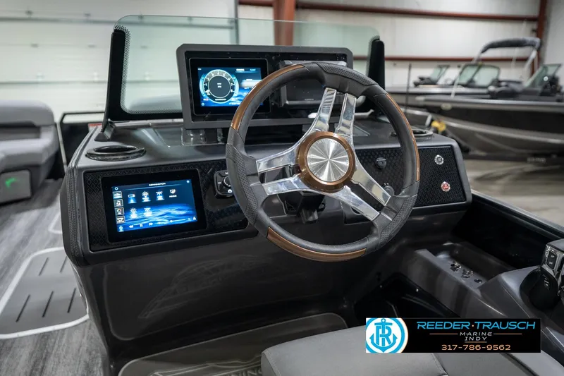 Slide: The Image of Interior of 2026 Bennington 26 MSB boat with storage compartment and pull-out tray. - 32