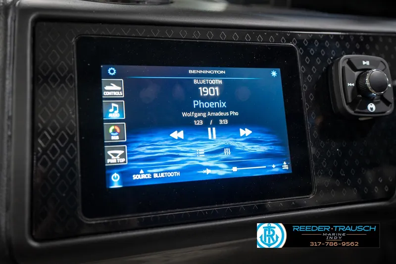 Slide: The Image of 2026 Bennington 26 MSB boat dashboard with modern steering wheel and digital displays. - 33